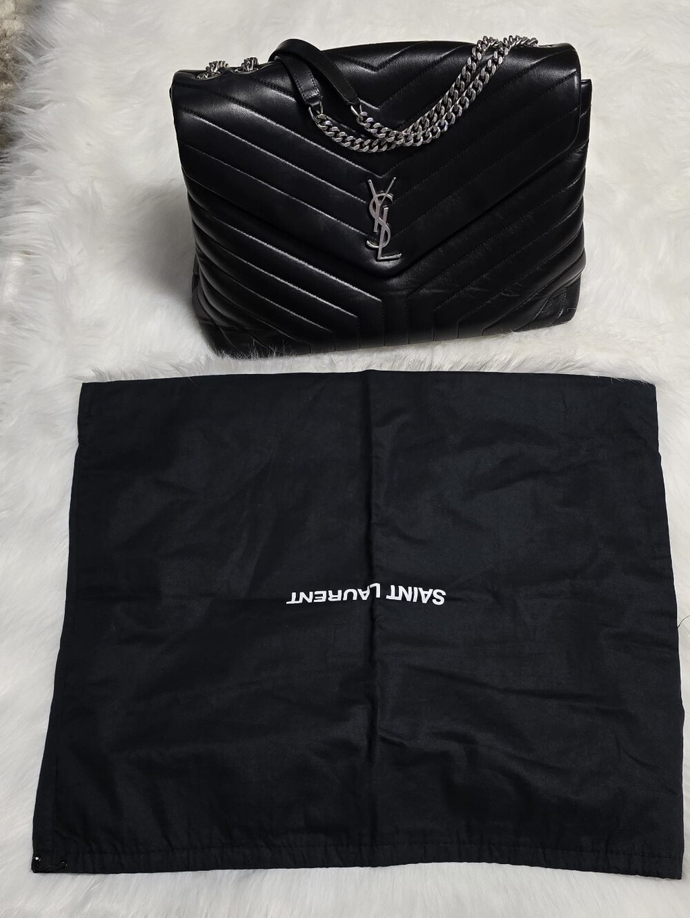 Saint Laurent Black Leather Shoulder Bag with Silver Zipper.